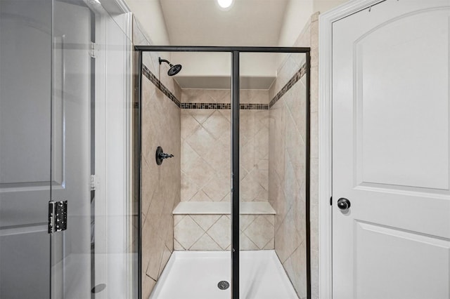 bathroom with a shower with shower door