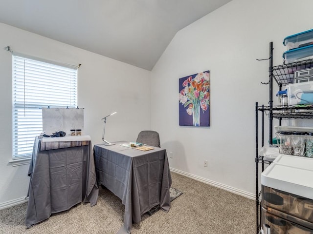 carpeted office space with lofted ceiling