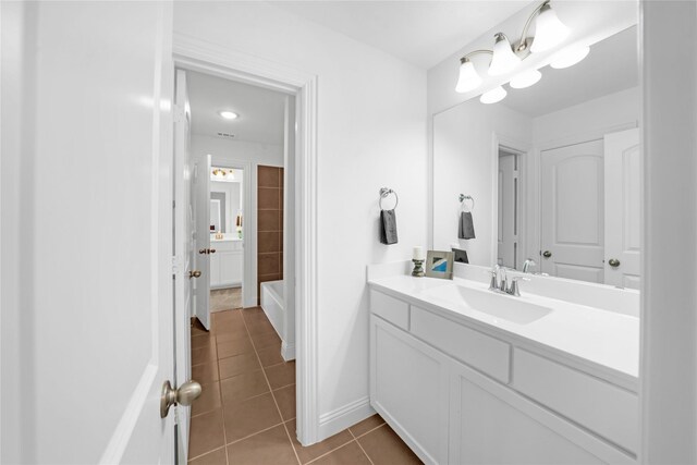 bathroom featuring tile patterned flooring and vanity