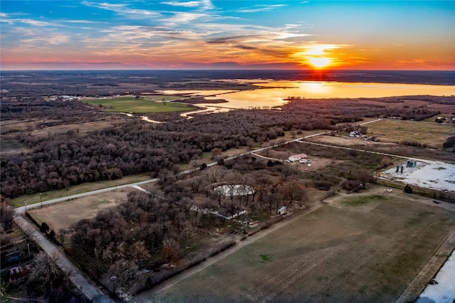 aerial view at dusk featuring a rural view