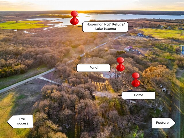 aerial view at dusk with a water view