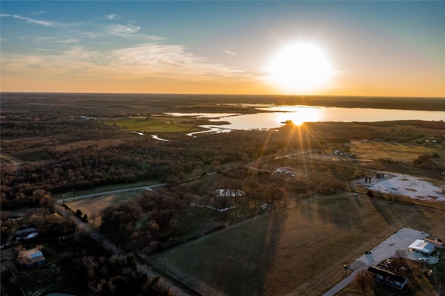 aerial view at dusk with a water view