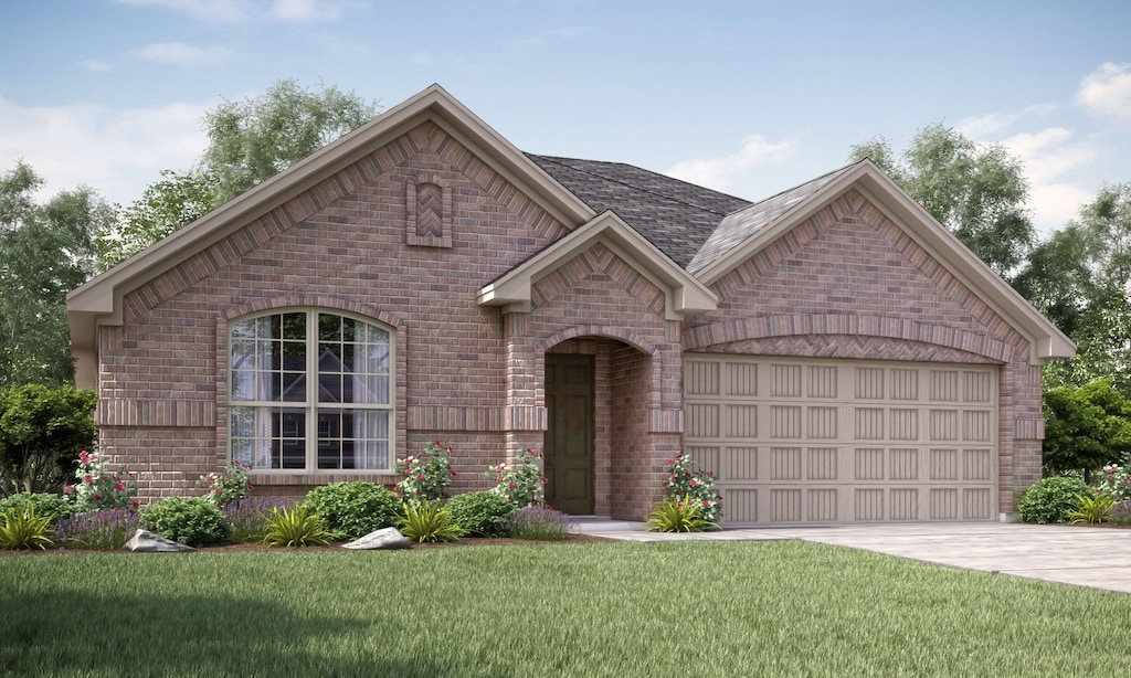 view of front of house with a garage and a front lawn