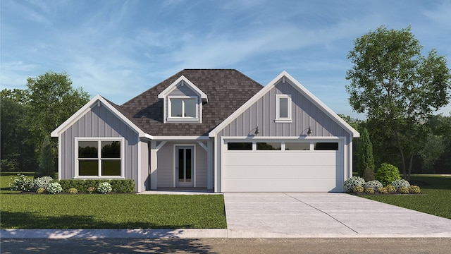 view of front of home with a garage and a front lawn