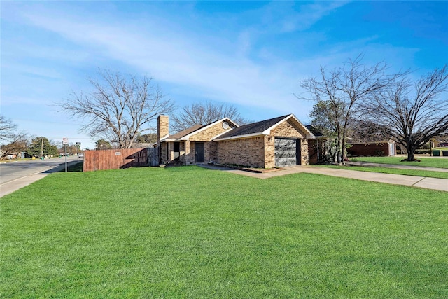 exterior space with a yard and a garage