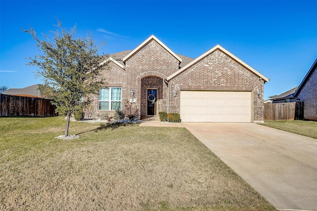 view of front of property featuring a garage and a front lawn