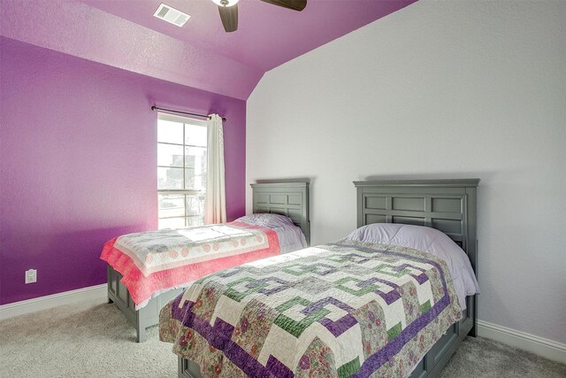 bedroom featuring ceiling fan, light colored carpet, and lofted ceiling