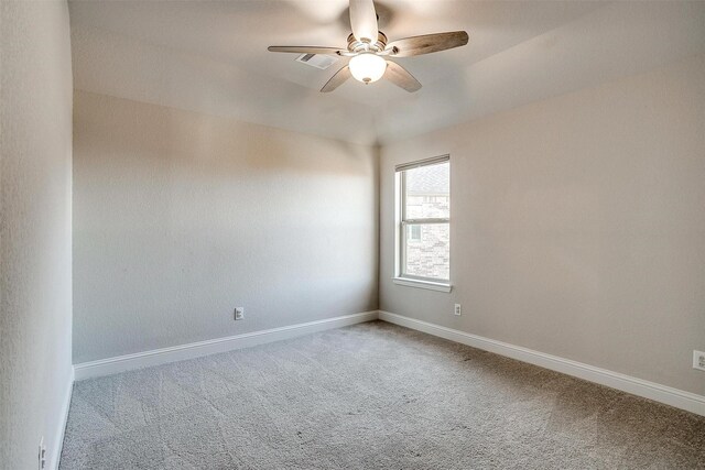 empty room with ceiling fan and carpet floors