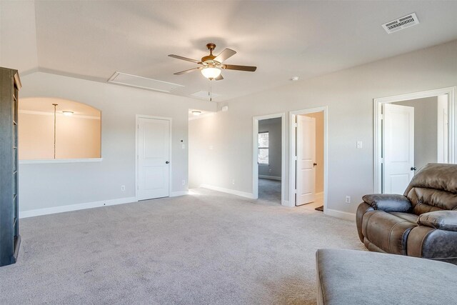 unfurnished living room with light carpet and ceiling fan