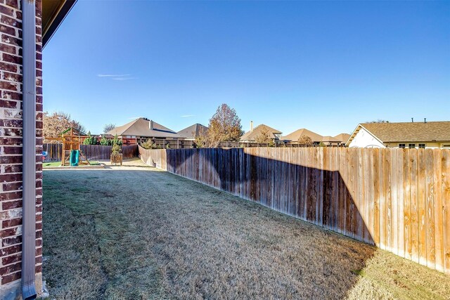 view of yard with a playground