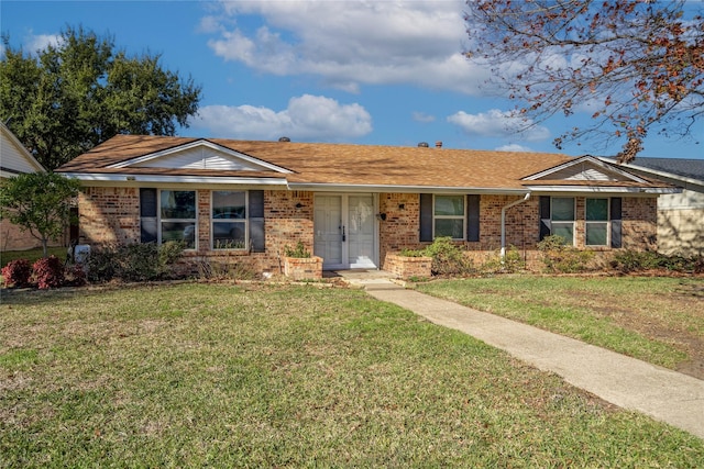 ranch-style home featuring a front yard