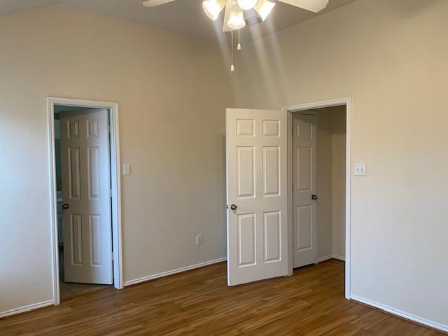 unfurnished bedroom featuring dark carpet