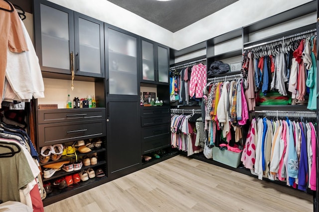 walk in closet featuring light wood-type flooring