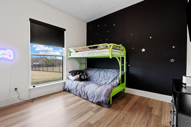 bedroom with wood-type flooring