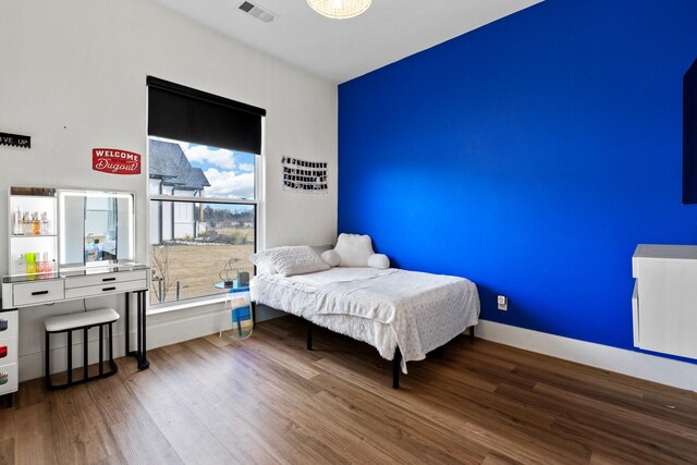 bedroom featuring hardwood / wood-style flooring