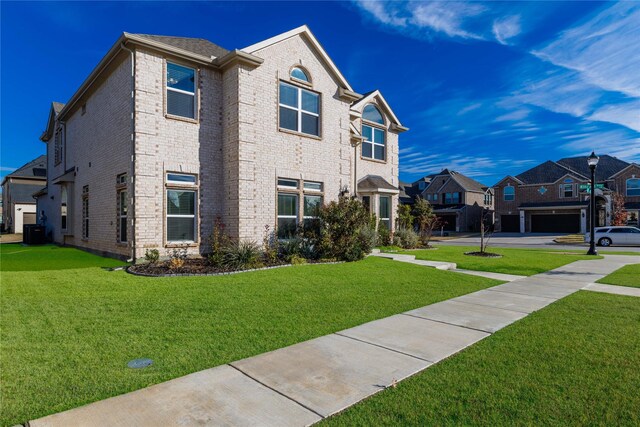 view of side of home featuring a lawn and central AC unit