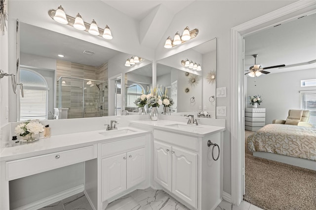 bathroom featuring walk in shower, vanity, and ceiling fan