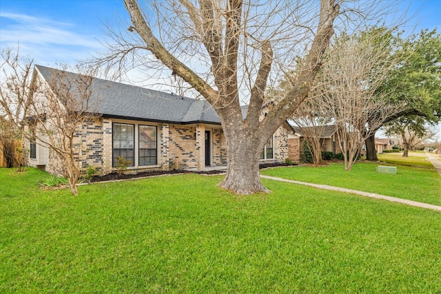 single story home featuring a front yard