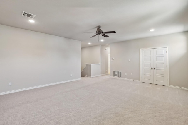 carpeted empty room with ceiling fan