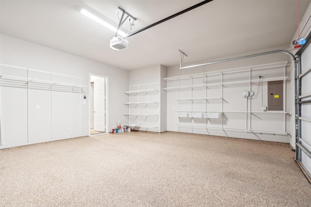 garage with electric panel and a garage door opener