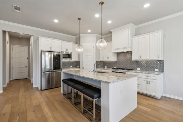 kitchen featuring sink, white cabinets, and appliances with stainless steel finishes