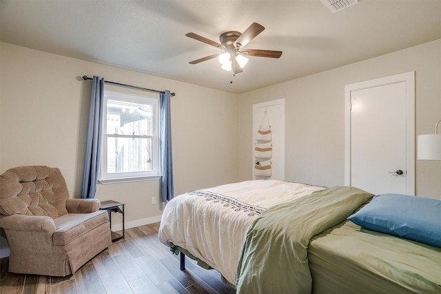 bedroom featuring hardwood / wood-style flooring and ceiling fan