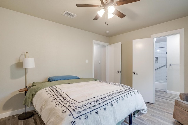 bedroom with ceiling fan and hardwood / wood-style flooring