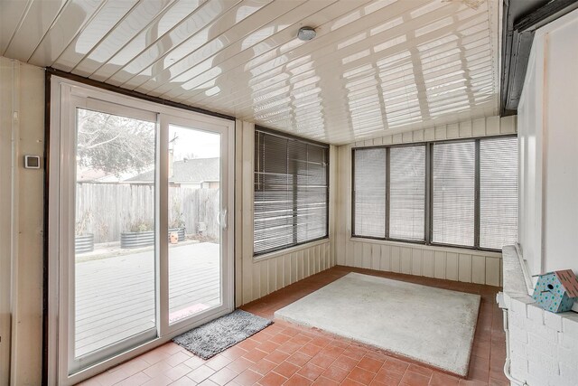 sunroom / solarium with lofted ceiling