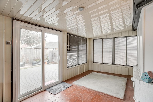 sunroom / solarium with vaulted ceiling