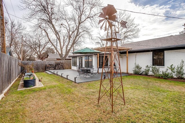 rear view of property with a patio area and a yard