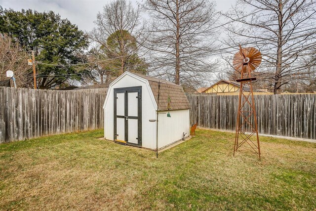 view of outbuilding with a lawn