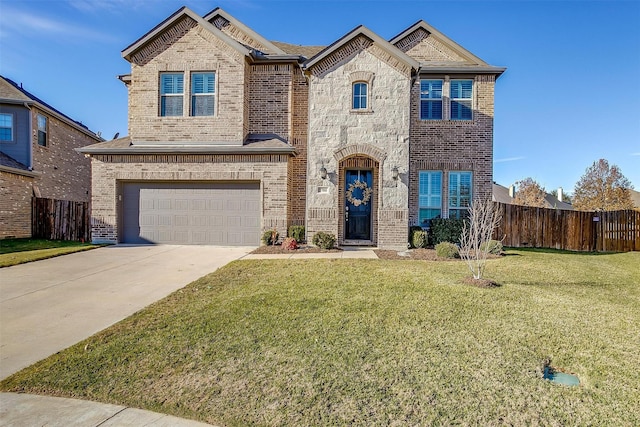 view of front of property featuring a garage and a front yard