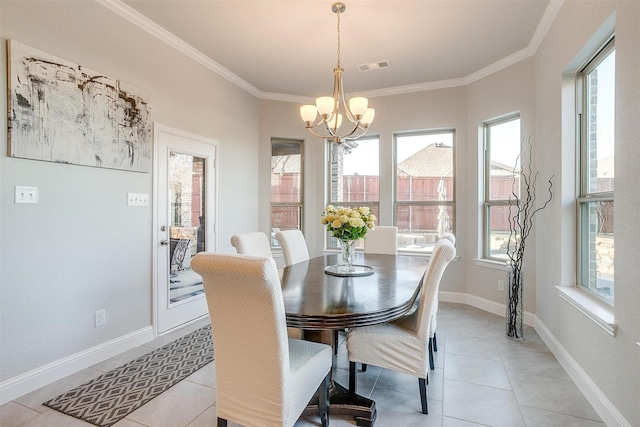 tiled dining area with ornamental molding and a chandelier