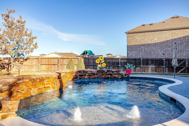 view of swimming pool with pool water feature