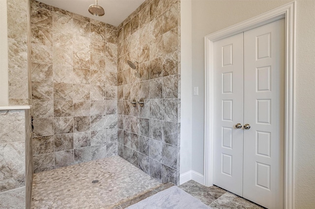 bathroom with tiled shower