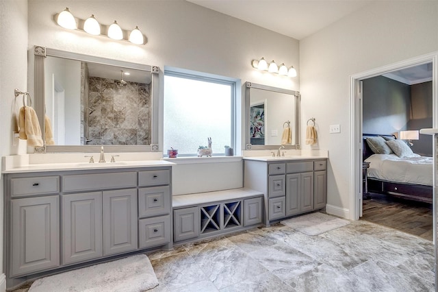 bathroom with vanity and a shower