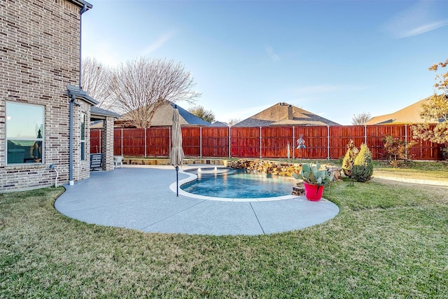 view of swimming pool with a yard and a patio