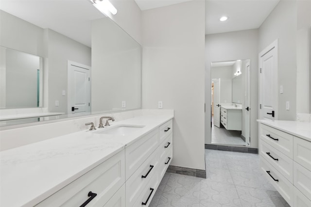 bathroom with tile patterned flooring and vanity