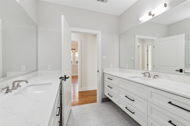 bathroom featuring tile patterned floors and vanity