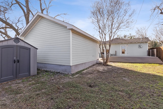 view of property exterior with a yard and a shed