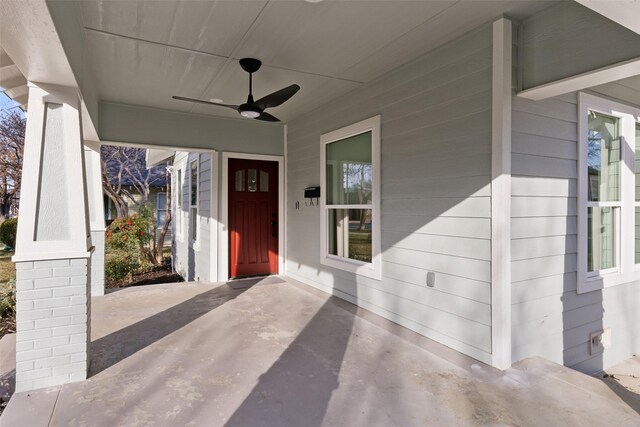 view of exterior entry with ceiling fan