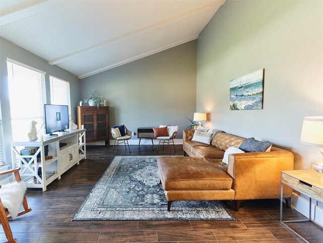 living room with vaulted ceiling with beams