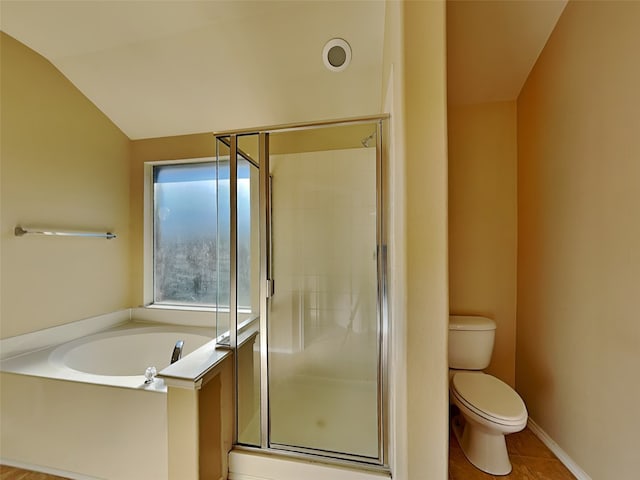 bathroom featuring tile patterned flooring, plus walk in shower, lofted ceiling, and toilet