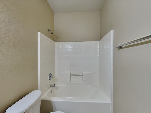 bathroom with toilet and shower / washtub combination