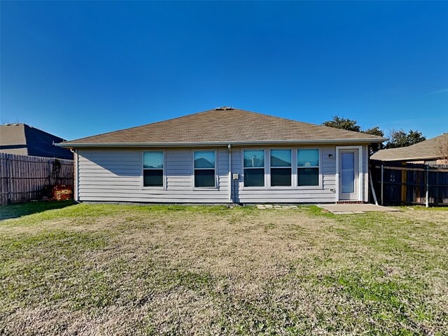 back of house with a yard