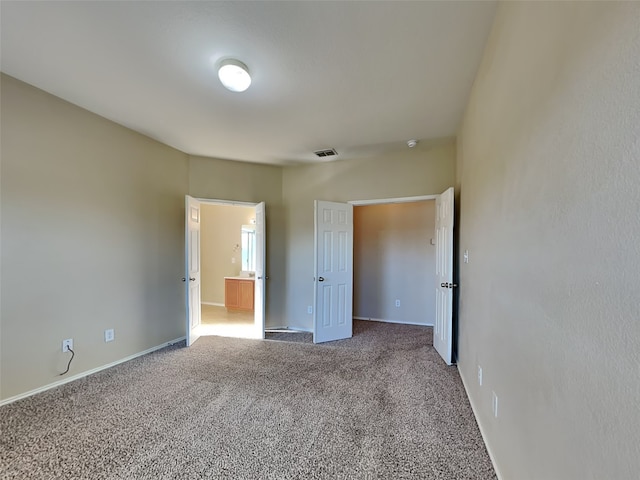 unfurnished bedroom featuring carpet flooring