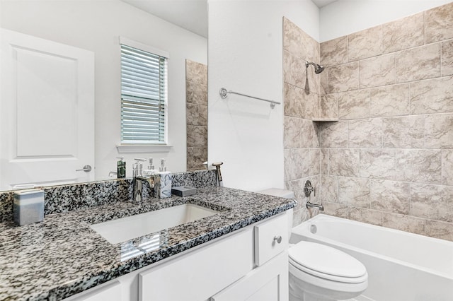 full bathroom featuring vanity, toilet, and tiled shower / bath combo