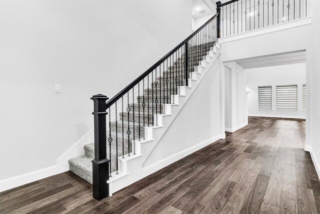 staircase featuring hardwood / wood-style floors