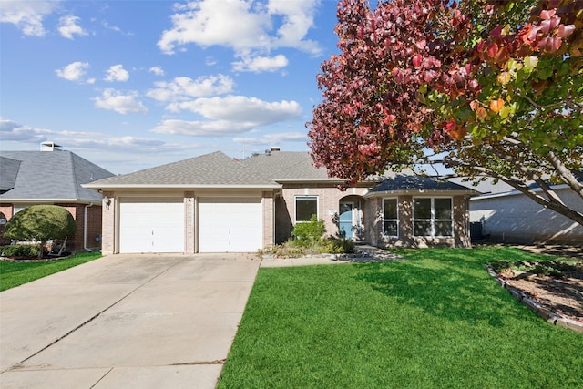 ranch-style home with a front yard and a garage