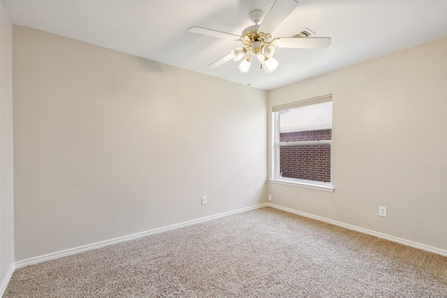 carpeted empty room featuring ceiling fan